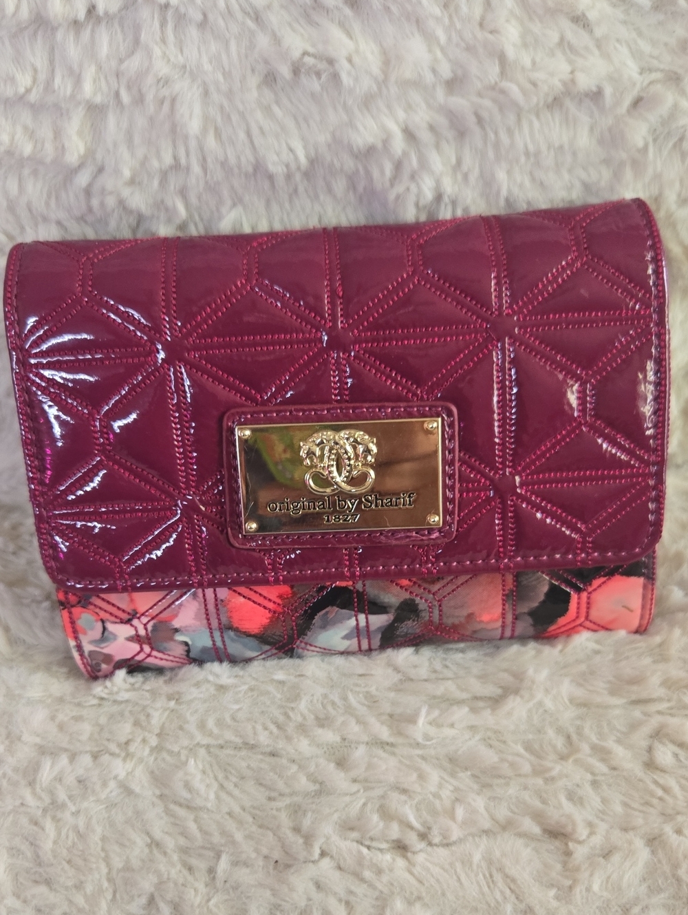Sharif raspberry patent quilted clutch with floral trim